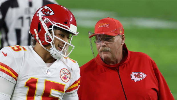 Kansas City Chiefs quarterback Patrick Mahomes talks with head coach Andy Reid.