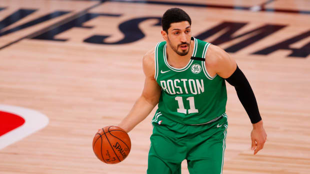 Boston Celtics center Enes Kanter Freedom handles the ball.