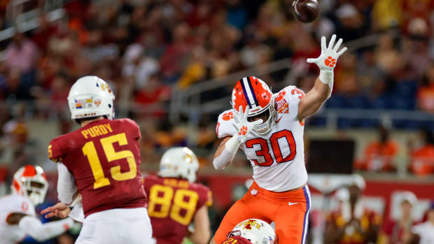 Clemson linebacker Keith Maguire attempts to block a pass during the Cheez-It Bowl against Iowa State.