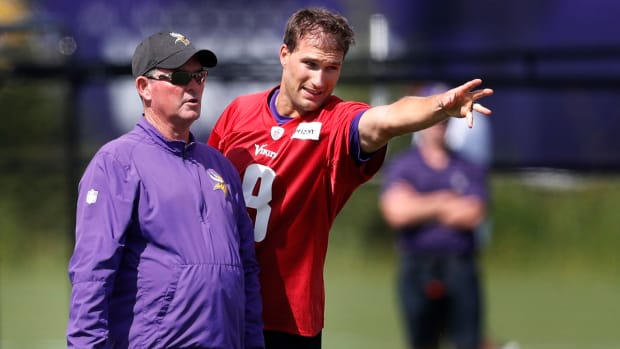 Minnesota Vikings head coach Mike Zimmer left and quarterback Kirk Cousins (8) went over a play during Minnesota Vikings training camp at TCO Performance center Saturday July 28, 2018 in Eagan, MN.