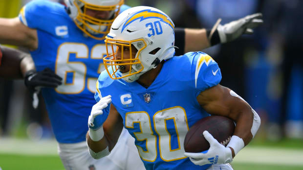 Chargers running back Austin Ekeler carries the ball.