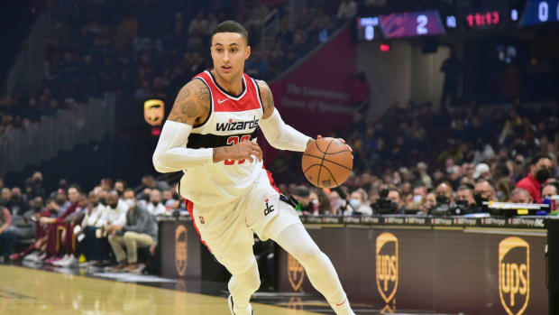 Wizards forward Kyle Kuzma drives to the basket, dribbling with his left hand.