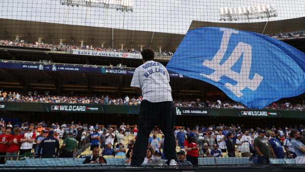 A Los Angeles Dodgers flag is waved at Dodger Stadium.
