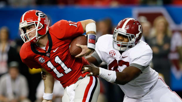 Aaron Murray tries to escape an Alabama defender.