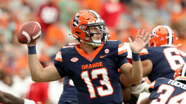 Syracuse quarterback Tommy Devito throws a pass.