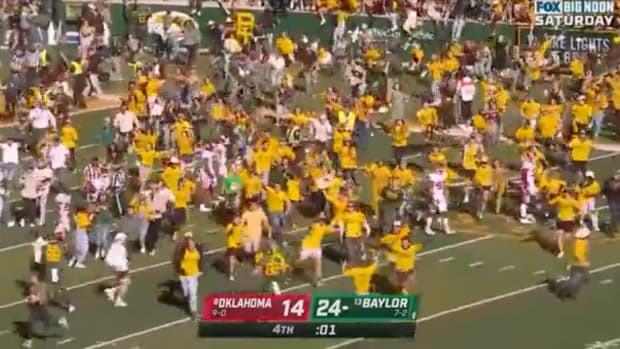 Baylor fans storm the field early.