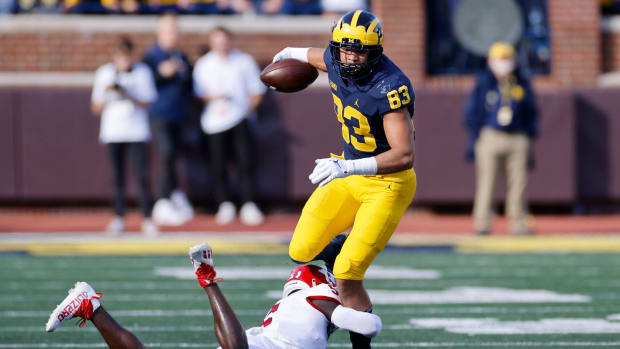 Michigan tight end Erick All tries to break a tackle.
