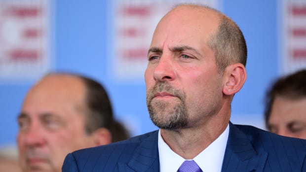 John Smoltz sits during the Hall of Fame ceremony.