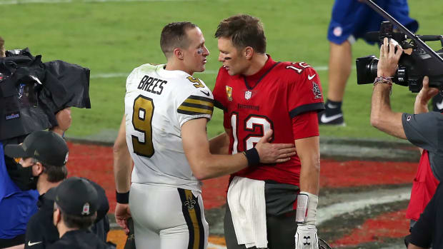 Drew Brees and Tom Brady speak after a game.