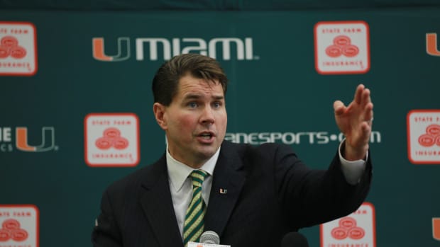 Al Golden points during his intro press conference.