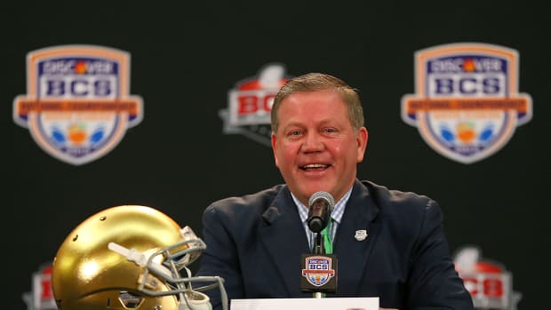 Notre Dame coach Brian Kelly speaking at a press conference.