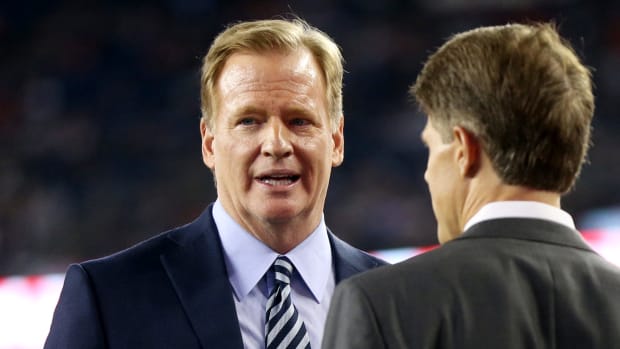 Roger Goodell talking to someone.