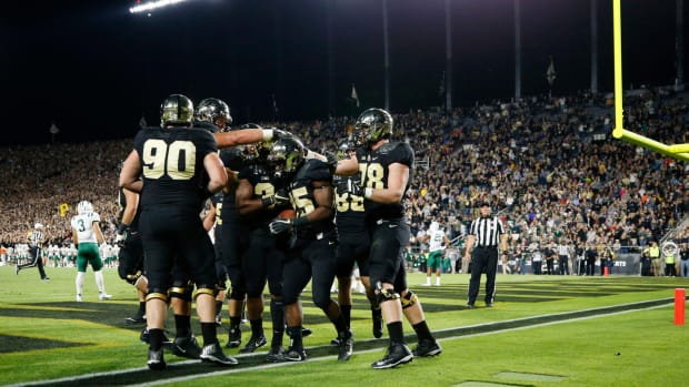 Purdue football players celebrating a touchdown.