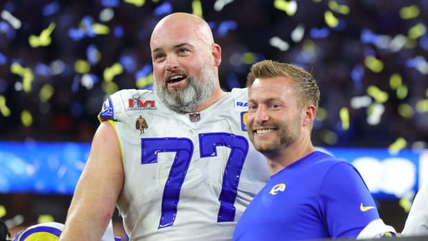 Los Angeles Rams head coach Sean McVay and offensive tackle Andrew Whitworth celebrate a Super Bowl win.