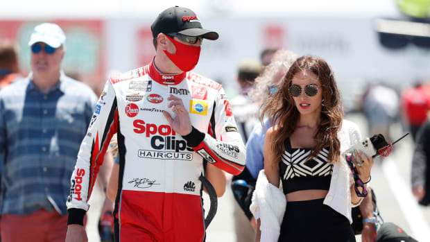 Kyle Busch and his wife Samantha at a NASCAR race
