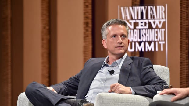 Bill Simmons sitting on stage at an event.