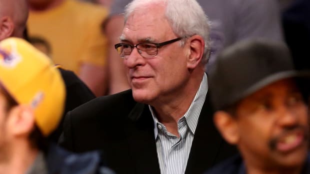 A candid photo of Phil Jackson in the stands at a Lakers game.