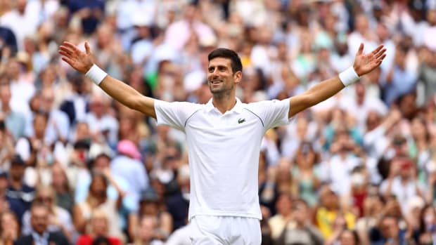 Novak Djokovic celebrates winning at Wimbledon.
