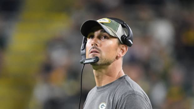 Matt LaFleur looks up from the sidelines in a Packers preseason game.