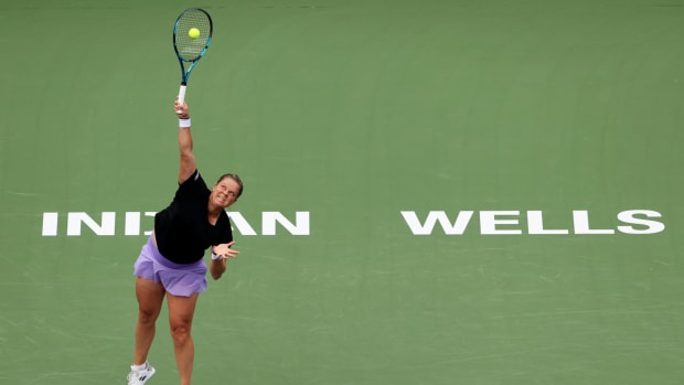 Kim Clijsters serves the ball.