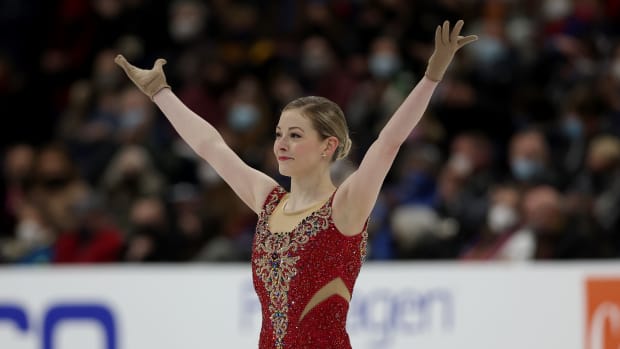 US Olympic figure skater Gracie Gold celebrates following her routine on the ice.