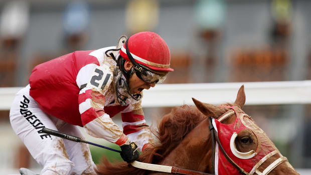 LOUISVILLE, KENTUCKY - MAY 07: Jockey Sonny Leon reacts as Rich Strike wins the 148th running of the Kentucky Derby at Churchill Downs on May 07, 2022 in Louisville, Kentucky. (Photo by Ezra Shaw/Getty Images)