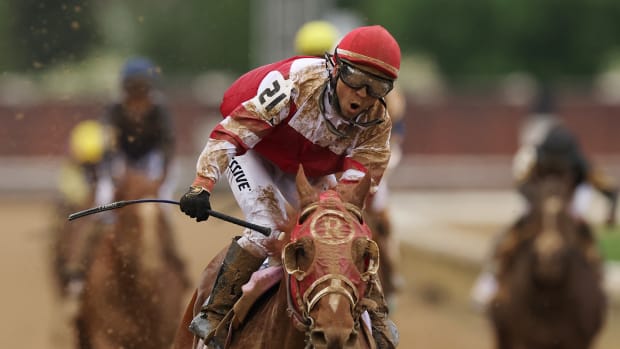 LOUISVILLE, KENTUCKY - MAY 07: Jockey Sonny Leon reacts as Rich Strike wins the 148th running of the Kentucky Derby at Churchill Downs on May 07, 2022 in Louisville, Kentucky. (Photo by Ezra Shaw/Getty Images)