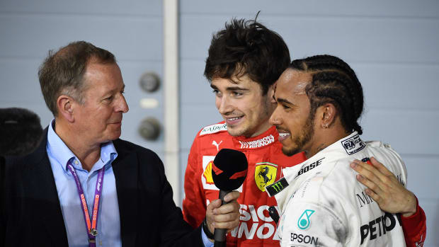 Formula 1 host Martin Brundle with Charles Leclerc and Lewis Hamilton following a race in 2019.