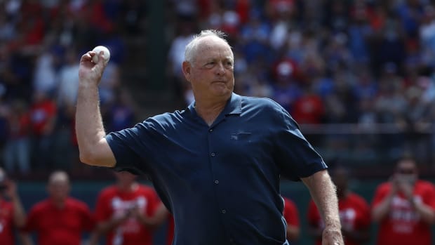 Nolan Ryan throws out the first pitch before a Texas Rangers game.
