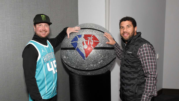 CHARLOTTE, NC - JANUARY 21: NASCAR drivers Kurt Busch and Bubba Wallace poses for photo prior to the game of Charlotte Hornets against the Oklahoma City Thunder on January 21, 2022 at Spectrum Center in Charlotte, North Carolina. NOTE TO USER: User expressly acknowledges and agrees that, by downloading and or using this photograph, User is consenting to the terms and conditions of the Getty Images License Agreement. Mandatory Copyright Notice: Copyright 2022 NBAE (Photo by David Dow/NBAE via Getty Images)