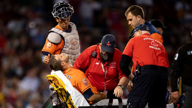 Astros pitcher Jake Odorizzi on a stretcher leaving the field.
