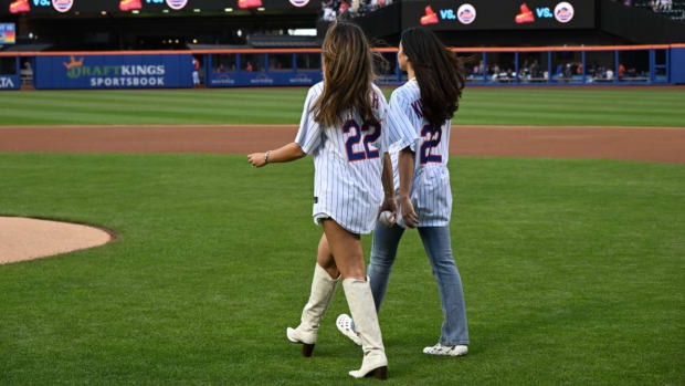 New York Mets first pitch featuring Sports Illustrated Swimsuit issue models.