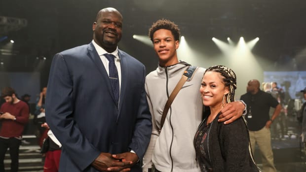 Shaunie O'Neal, the wife of legendary NBA big man Shaquille O'Neal, at an event with their son.