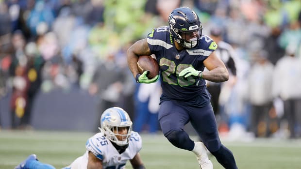 SEATTLE, WASHINGTON - JANUARY 02: Rashaad Penny #20 of the Seattle Seahawks carries the ball against the Detroit Lions during the third quarter at Lumen Field on January 02, 2022 in Seattle, Washington. (Photo by Steph Chambers/Getty Images)