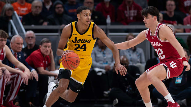 INDIANAPOLIS, IN - MARCH 12: Iowa Hawkeyes forward Kris Murray (24) dribbles past Indiana Hoosiers guard Trey Galloway (32) during the mens Big Ten tournament college basketball game between the Indiana Hoosiers and Iowa Hawkeyes on March 12, 2022, at Gainbridge Fieldhouse in Indianapolis, IN. (Photo by Zach Bolinger/Icon Sportswire via Getty Images)