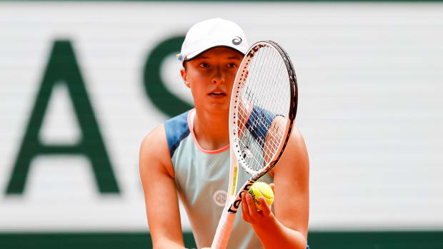 Iga Swiatek of Poland gets ready to serve at the French Open.