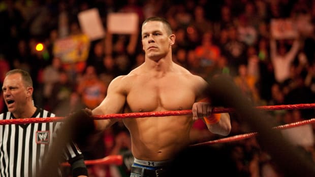 John Cena waits in the ring to face his opponents during WWE's Monday Night Raw at Rose Garden arena in Portland. (Photo by Chris Ryan/Corbis via Getty Images)