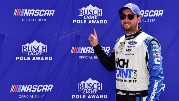 MADISON, ILLINOIS - JUNE 04: Chase Briscoe, driver of the #14 HighPoint.com Ford, signs the Busch Light Pole Award backdrop after winning the pole award for the NASCAR Cup Series Enjoy Illinois 300 at WWT Raceway on June 04, 2022 in Madison, Illinois. (Photo by Jeff Curry/Getty Images)