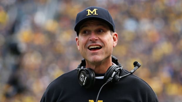 Head coach Jim Harbaugh of the Michigan Wolverines reacts during the college football game against the Michigan State Spartans at Michigan Stadium.