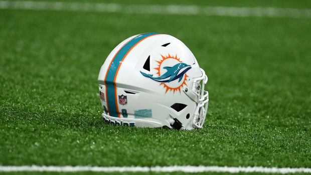 Miami Dolphins helmet sits on the turf.