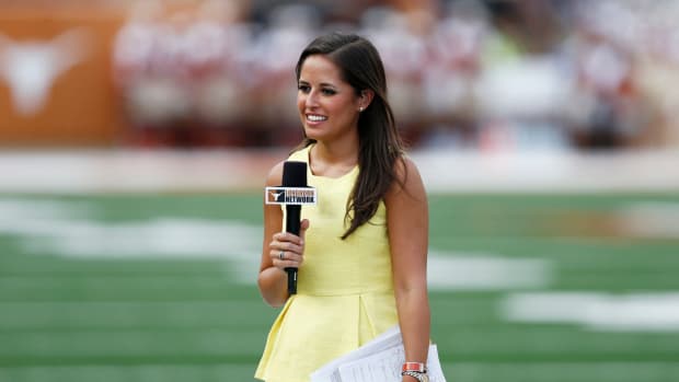 Kaylee Hartung working the sideline for ESPN at a game in Texas.