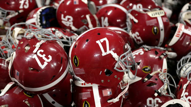 A detailed view of Alabama Crimson Tide helmets in a pile during the celebration after the CFP National Championship.