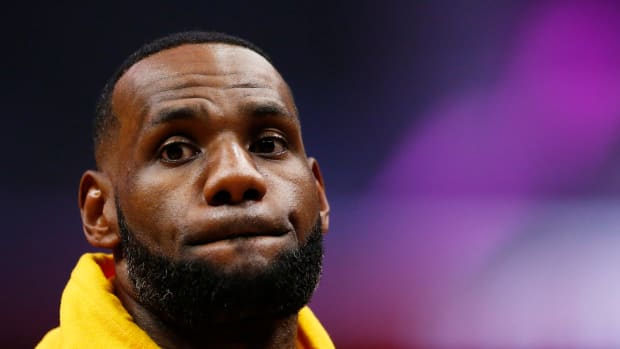 lebron james looks onto the court during an nba game
