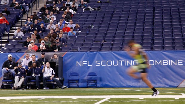 nfl coaches watch the scouting combine