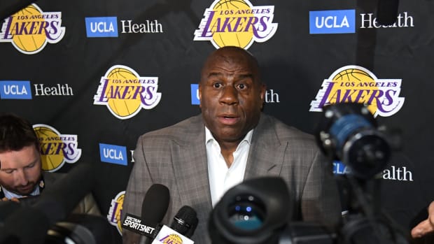 magic johnson speaks to reporters about his decision