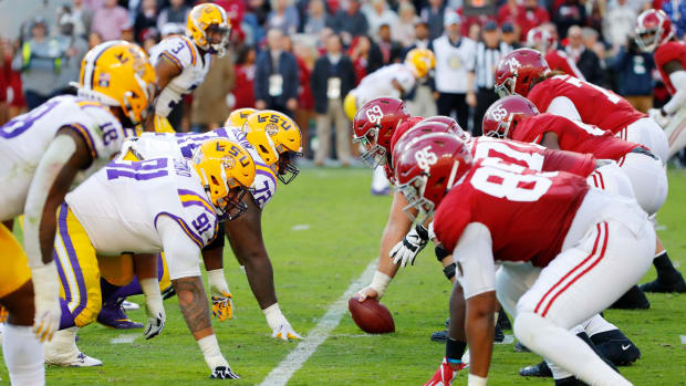 Alabama and LSU players line up during a huge SEC college football showdown at Bryant-Denny Stadium.