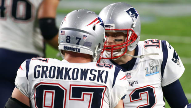 Tom Brady talking to Rob Gronkowski.