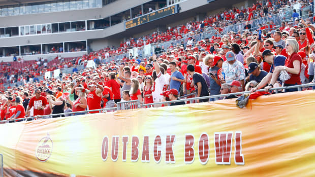 fans look onto the field during the outback bowl