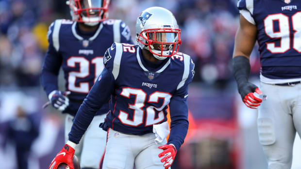 Devin McCourty celebrating after a fumble recovery.