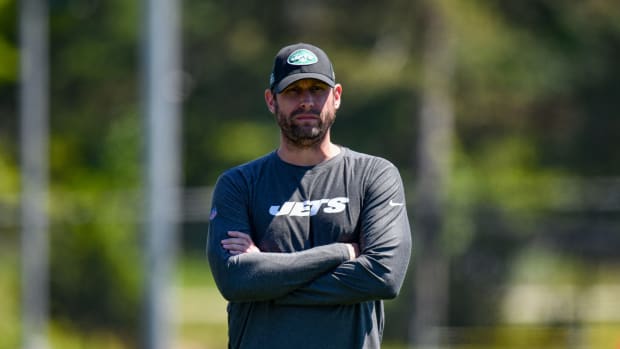 Adam Gase looks on at New York Jets practice.